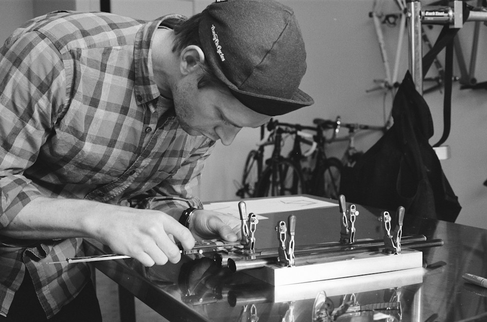 Argonaut Cycles founder Ben Farver working on a set of custom carbon seat stays